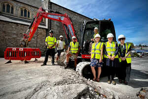(L-R) Gary Bendelow, Kelmend Jata and Vince Thorne of Classic Builders, Cllr Louise Cooke in the digger, Museum Assistant Lucy Cokes, Curator Joanna Eccles and Deputy Town Clerk Sam Scott | NATC